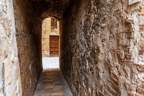 Narrow street in the old town in Tuscany