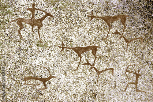 image of ancient hunting ancient man on the cave wall. history of antiquities. archaeology.