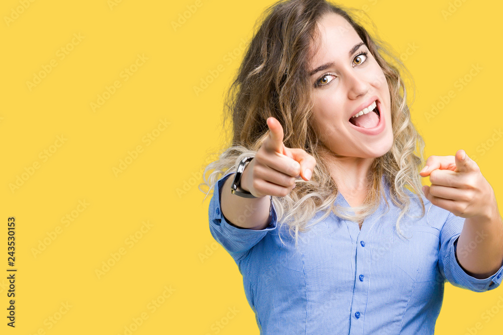 Beautiful young blonde business woman over isolated background Pointing to you and the camera with fingers, smiling positive and cheerful