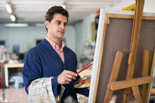 Artist painting on canvas