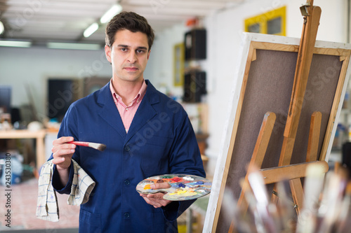 Male artist drawing in studio photo