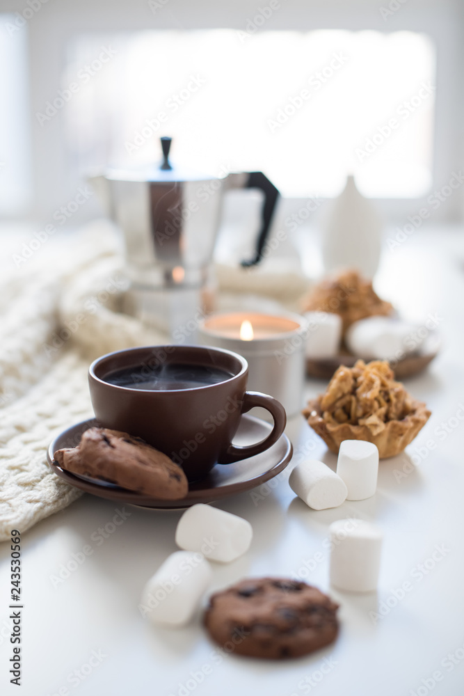 Cozy home breakfast with coffee and cookies on table Cozy home breakfast with coffee and cookies on table