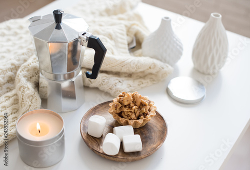 Cozy home breakfast with coffee and cookies on table