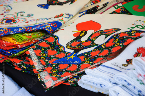 Souvenir towels with embroidery of the Galo de Barcelos (Barcelos Rooster) - traditional symbol of Portugal - at the street market in Porto (Portugal).