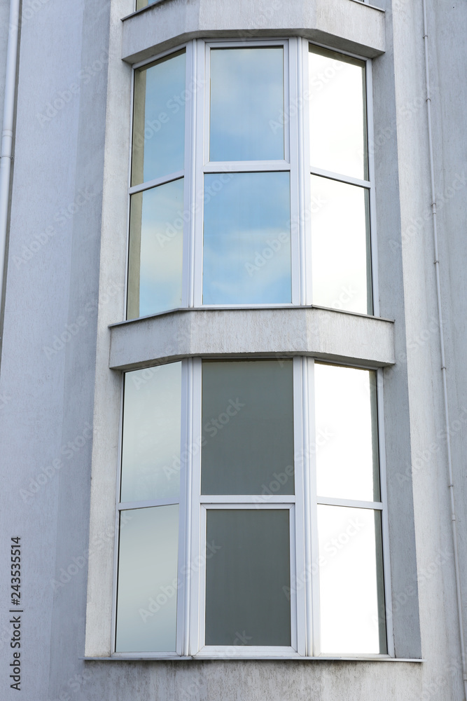 Modern office building with tinted windows. Urban architecture