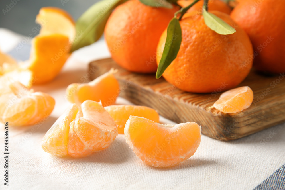 Ripe tangerines on table, closeup. Citrus fruit Ripe tangerines on table, closeup. Citrus fruit
