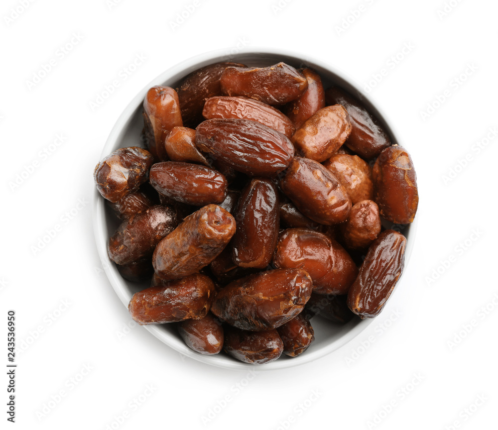 Bowl with sweet dried date fruits isolated on white, top view Bowl with sweet dried date fruits isolated on white, top view