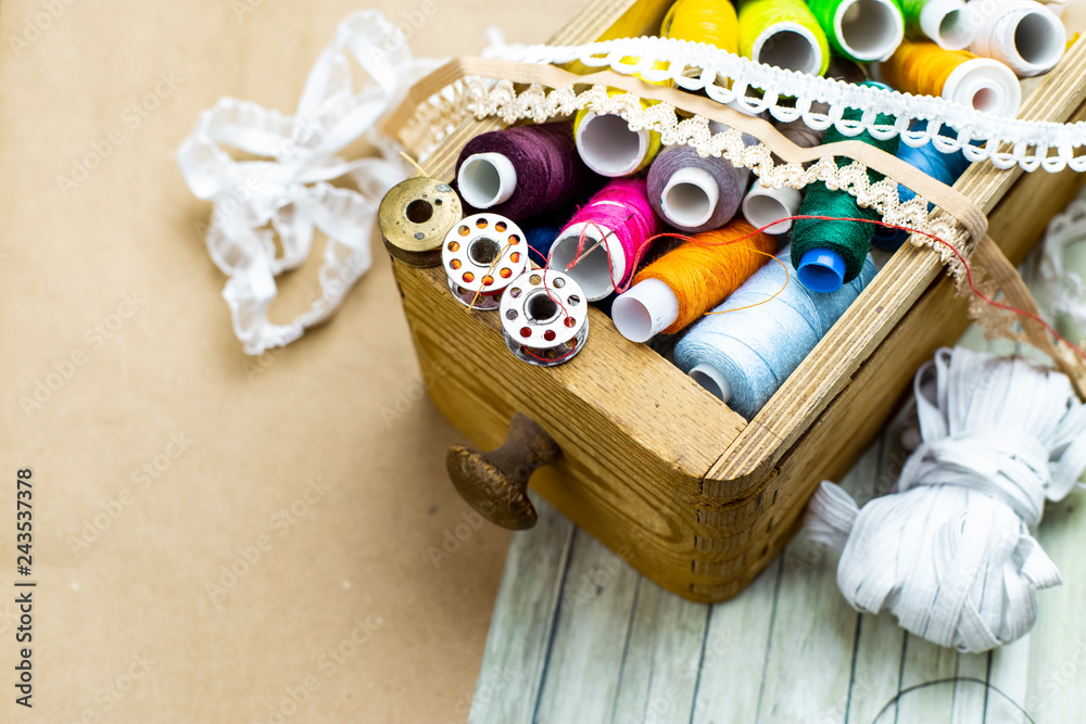 Colored Threads in a wooden box Colored Threads in a wooden box