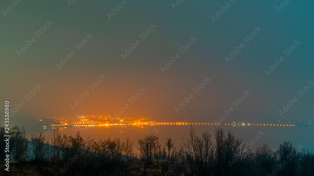 the lights of a village photographed over the Danube the lights of a village photographed over the Danube