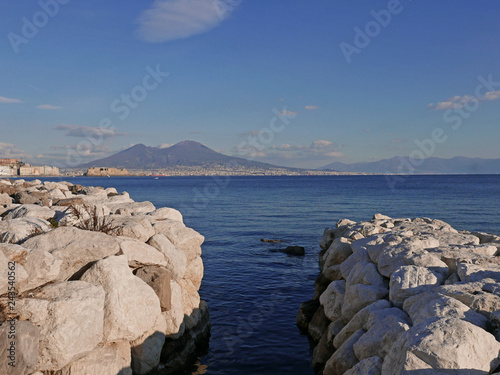 rilassante veduta della costa del mare di napoli con il vesuvio davanti photo