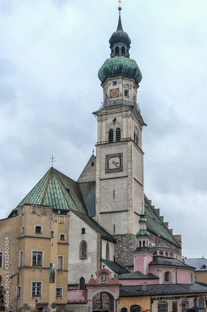 The parish church St Nicolas's Stadtpfarrkirche on the central square Oberer Stadtplatz, the true heart of the historic city center of Hall in Tyrol, Austria The parish church St Nicolas's Stadtpfarrkirche on the central square Oberer Stadtplatz, the true heart of the historic city center of Hall in Tyrol, Austria