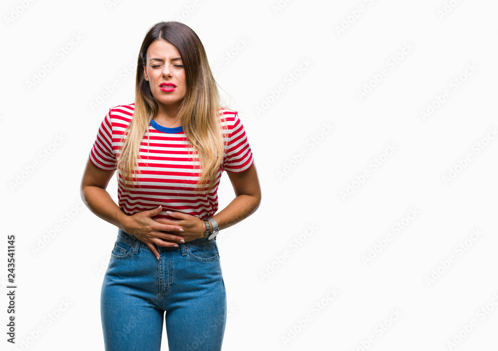 Young beautiful woman casual look over isolated background with hand on stomach because indigestion, painful illness feeling unwell. Ache concept.