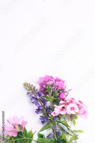 spring flowers on a white wooden background