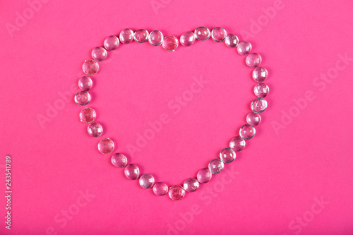 Beaded heart on a pink background horizontal