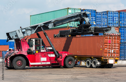 Car lifting containers from the truck