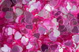 Valentine's day background made from heart shape glitters. Pink color. Love and passion concept. Flatlay, top view.