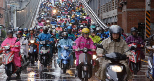  Crowded of scooter in taipei city at rain day photo