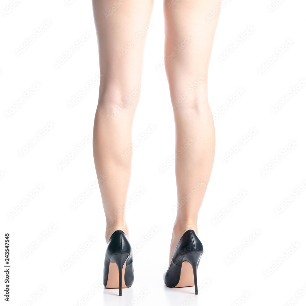 Female legs in black high heels shoes fashion on white background isolation, back view Female legs in black high heels shoes fashion on white background isolation, back view