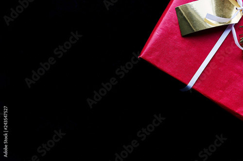 red gift box on black background