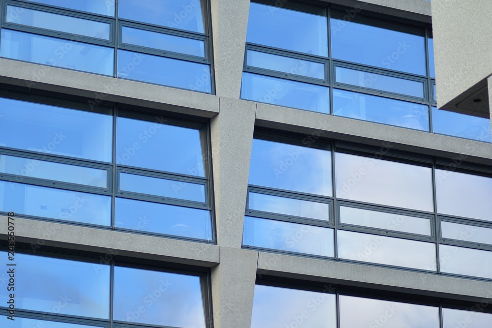 Abstract fragment of modern architecture, walls made of glass and concrete. Abstract fragment of modern architecture, walls made of glass and concrete.