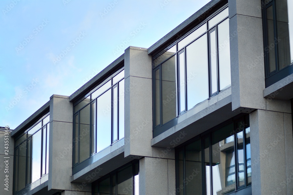 Abstract fragment of modern architecture, walls made of glass and concrete. Abstract fragment of modern architecture, walls made of glass and concrete.