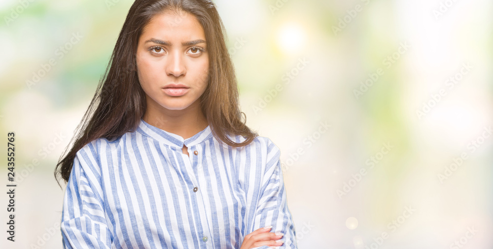 Young beautiful arab woman over isolated background skeptic and nervous, disapproving expression on face with crossed arms. Negative person. Young beautiful arab woman over isolated background skeptic and nervous, disapproving expression on face with crossed arms. Negative person.