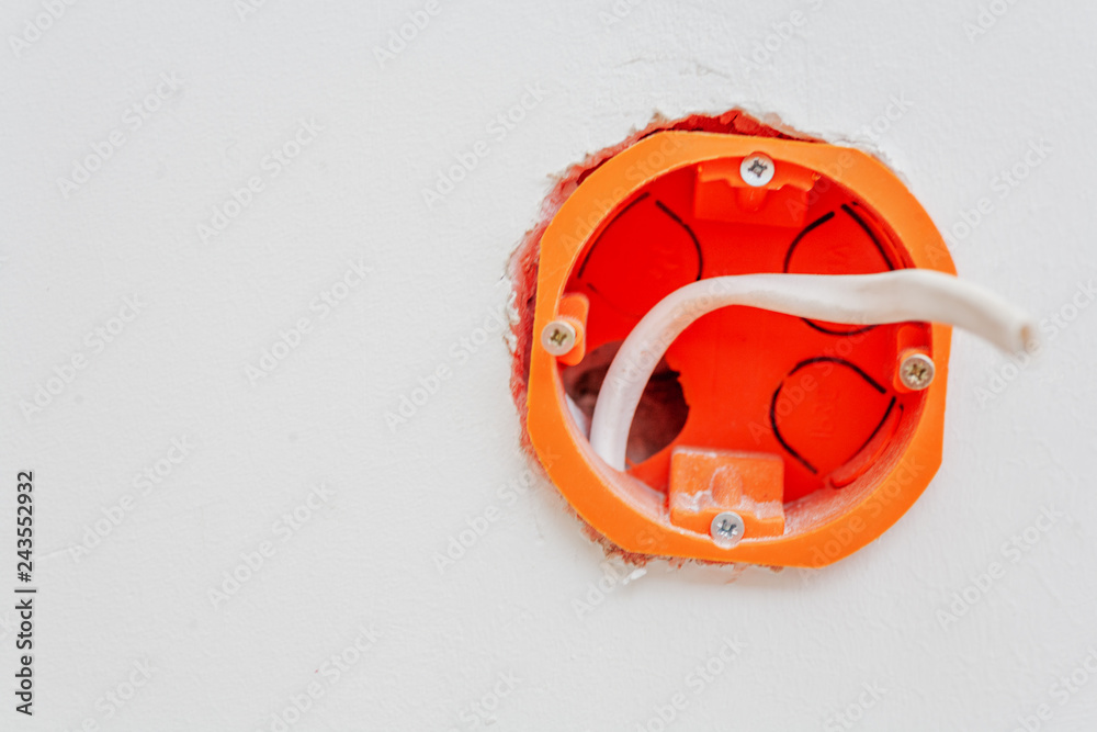 Electrical Outlet Box With Wire Installed in the wall Stock Photo