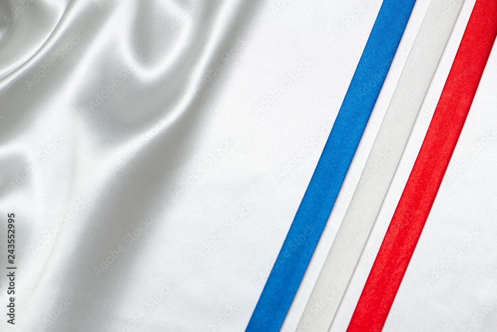 ribbon with france flag color on white silk background ribbon with france flag color on white silk background
