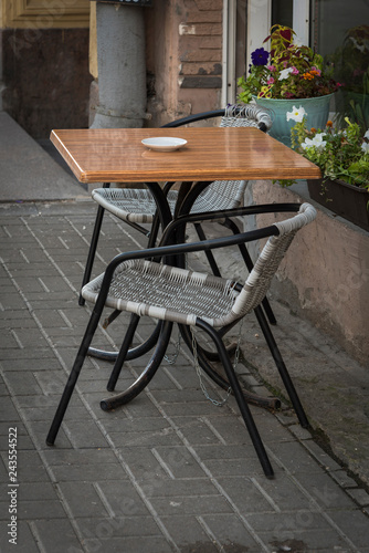 Table with chairs near the street café.