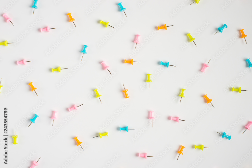 Set of office pins lies on a white background. Set of office pins lies on a white background.