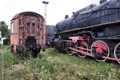 An old and historic steam locomotive and wagon