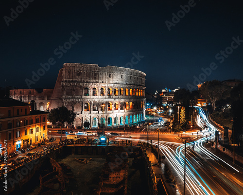 Coliseum or Flavian Amphitheatre or Colosseum (Amphitheatrum Flavium or Colosseo), Rome, Italy. Night lights, long exposure photo photo
