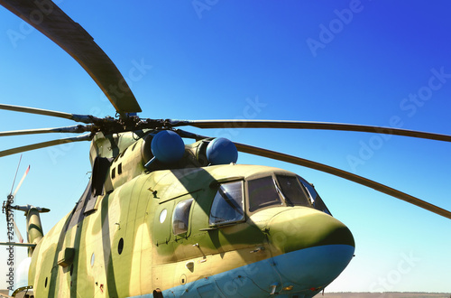 close-up military helicopter equipped with guided anti-tank missiles and aircraft missiles