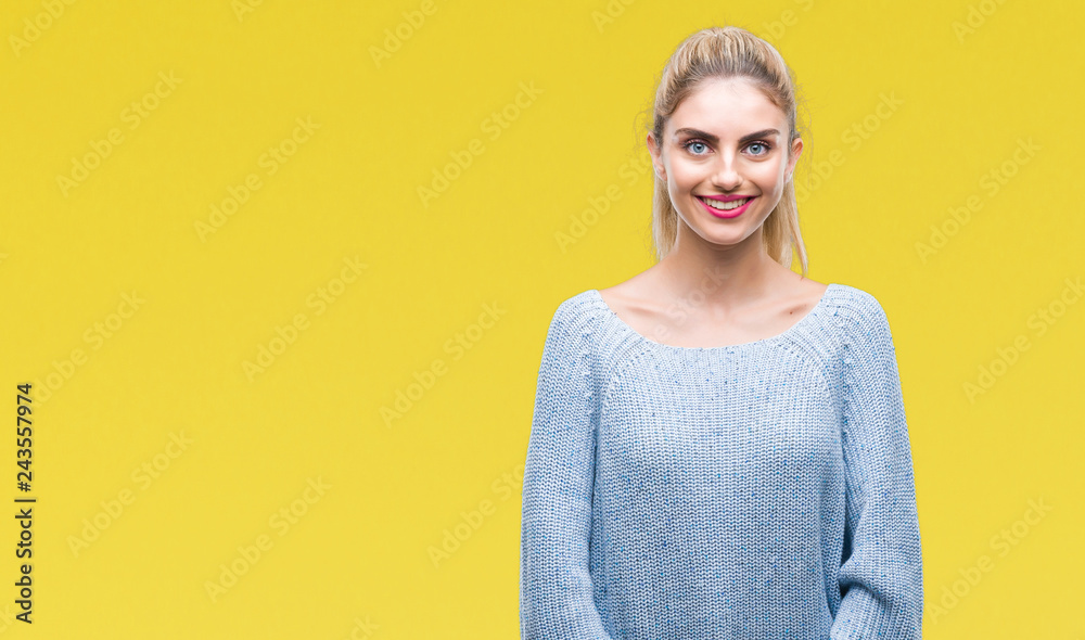 Fototapeta premium Young beautiful blonde and blue eyes woman wearing winter sweater over isolated background with a happy and cool smile on face. Lucky person.