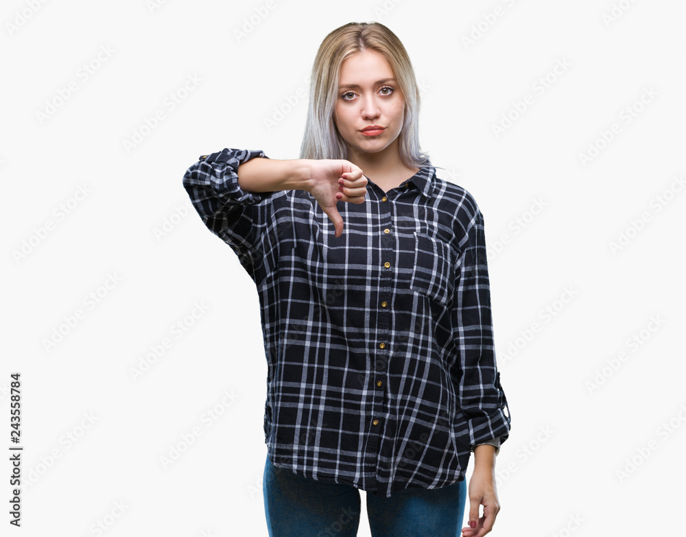 Young blonde woman over isolated background looking unhappy and angry showing rejection and negative with thumbs down gesture. Bad expression. Young blonde woman over isolated background looking unhappy and angry showing rejection and negative with thumbs down gesture. Bad expression.
