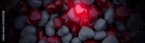 Świecące czerwone serce na tle innych serc
