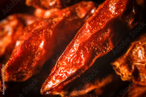 Dried red chili peppers, type pipi piri or capsicum frutescens macro background photo