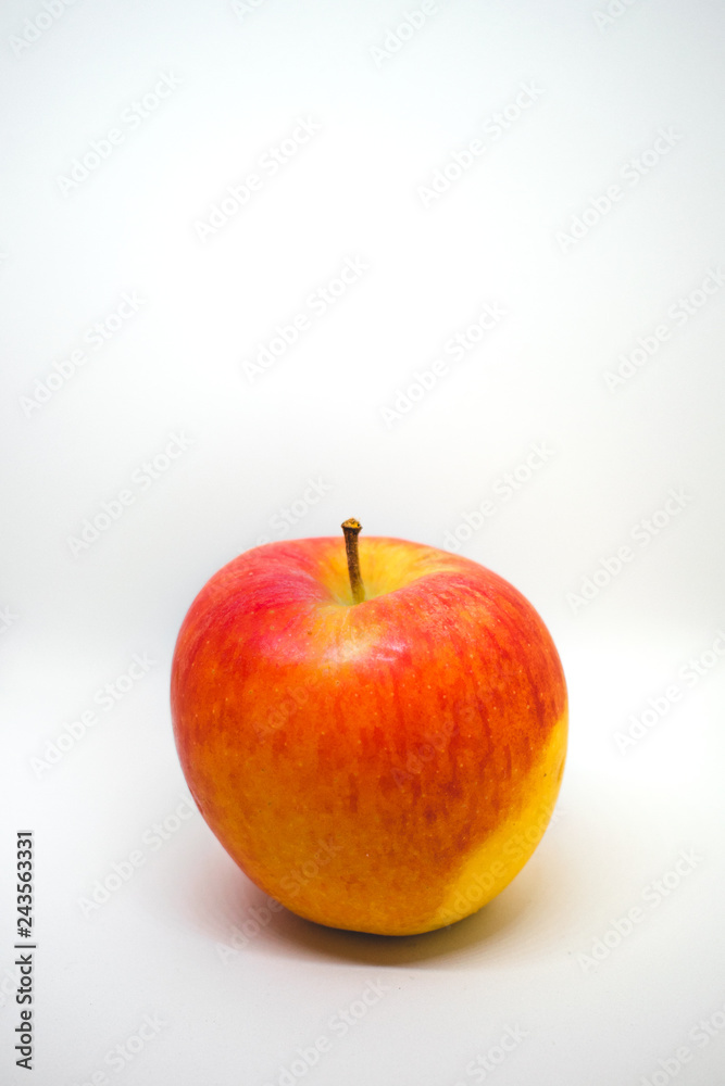 A close-up of a natural looking apple isolated on white background A close-up of a natural looking apple isolated on white background