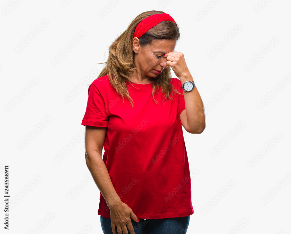 Middle age senior hispanic woman over isolated background tired rubbing nose and eyes feeling fatigue and headache. Stress and frustration concept. Middle age senior hispanic woman over isolated background tired rubbing nose and eyes feeling fatigue and headache. Stress and frustration concept.