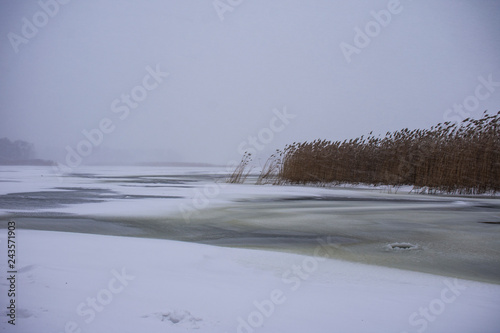 Winter landscape on the frozen river