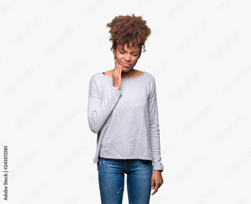 Beautiful young african american woman over isolated background touching mouth with hand with painful expression because of toothache or dental illness on teeth. Dentist concept.