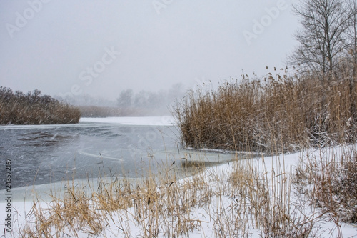 Winter landscape on the frozen river