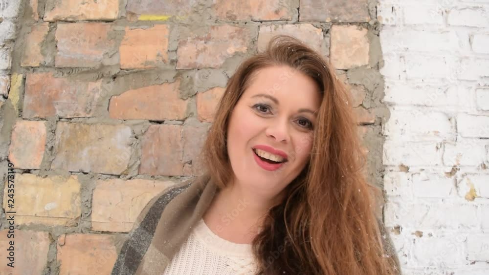 Beautiful fat woman with different emotions on the background of an old brick wall. Beautiful fat woman with different emotions on the background of an old brick wall.
