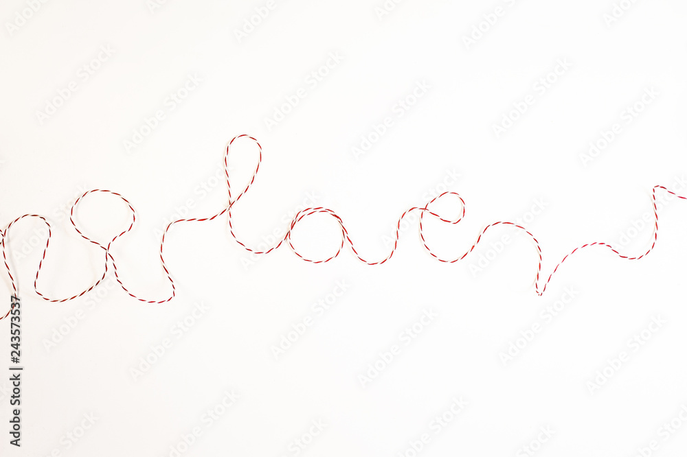 Word love made of red ribbon, on white background