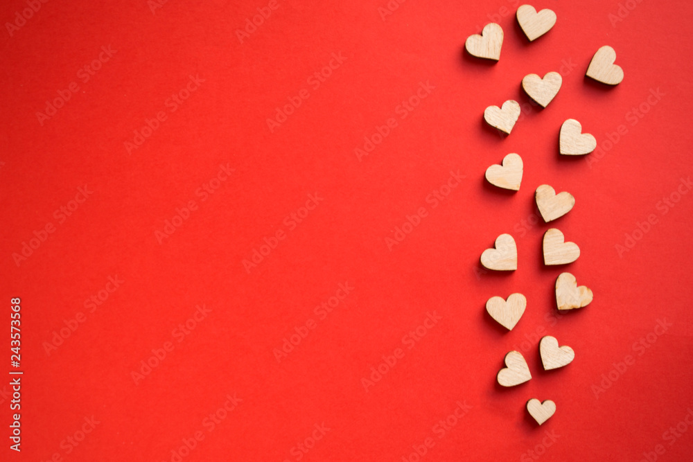 Red background with wooden hearts, place for text.