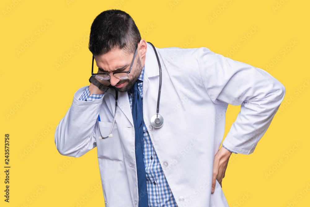 Handsome young doctor man over isolated background Suffering of neck ache injury, touching neck with hand, muscular pain Handsome young doctor man over isolated background Suffering of neck ache injury, touching neck with hand, muscular pain