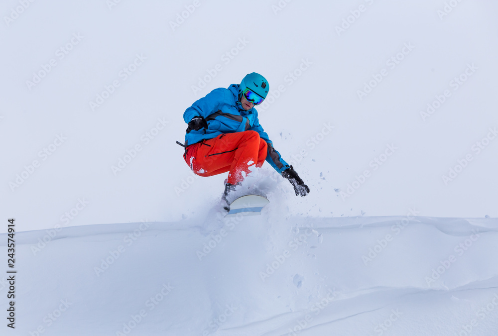 Snowboarder during a big jump, Austria.
