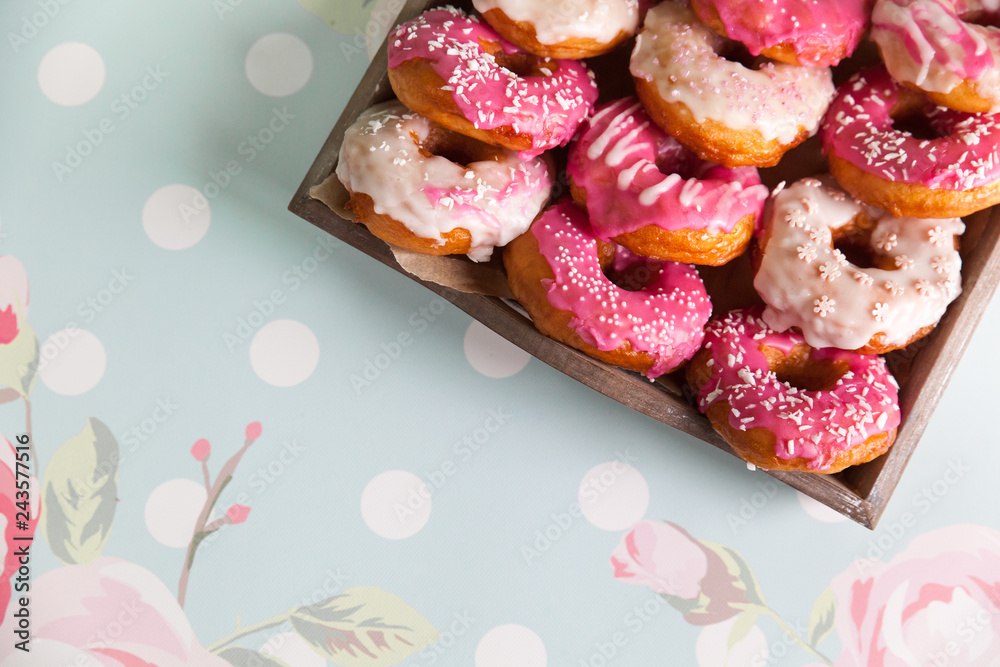 Sweet and colourful donuts with sprinkles and frosting Sweet and colourful donuts with sprinkles and frosting