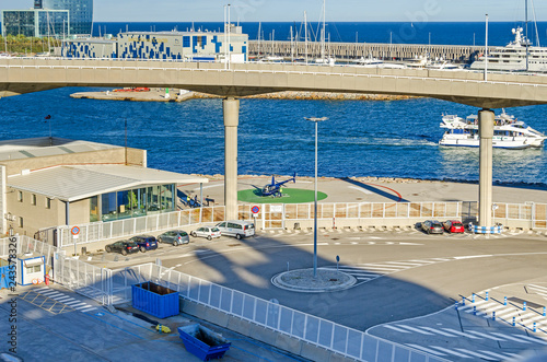 Obraz na plátně Port Vell in Barcelona with its cruise terminal, bridge Porta d'Europa and a hel