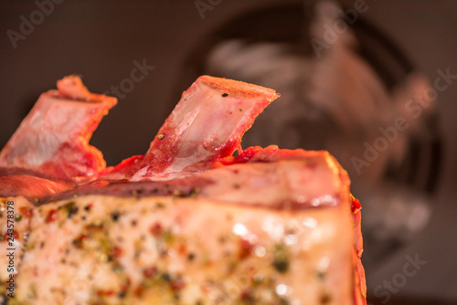 closeup view raw beef cross rib chunk on oven tray with foil inside oven photo